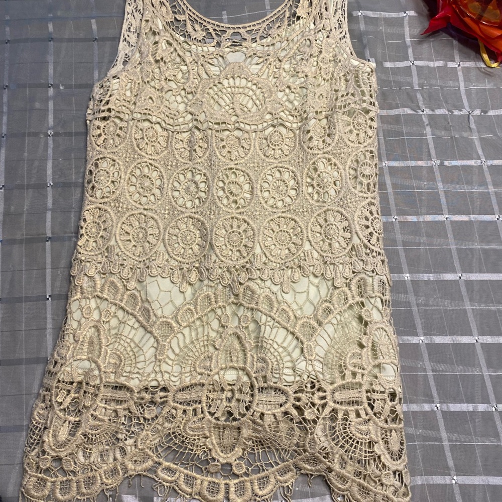 Pale lime green crochet top with gold accent. Never worn . Size medium